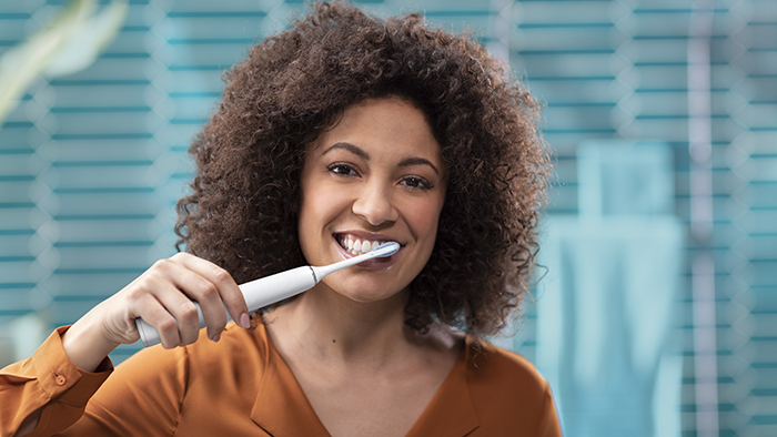 Woman brushing teeth