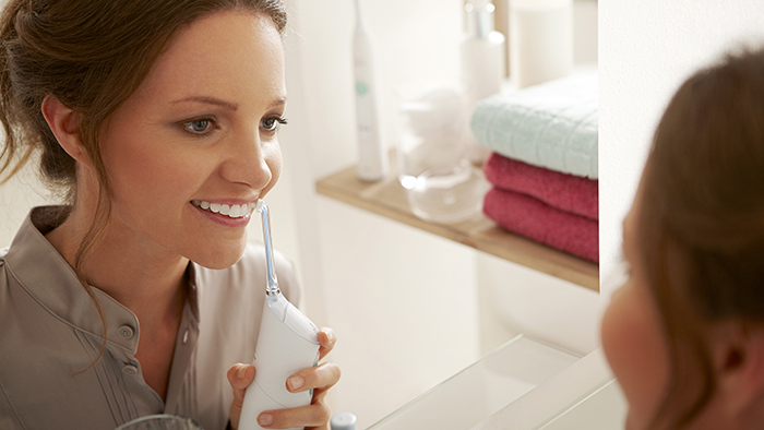 Woman flossing